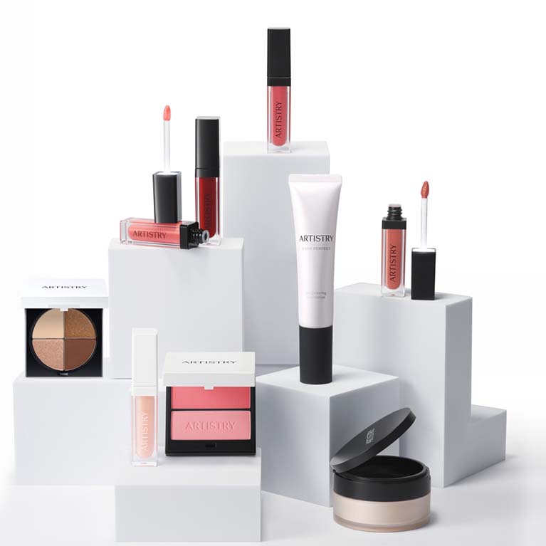 A pedestal display of Artistry makeup products